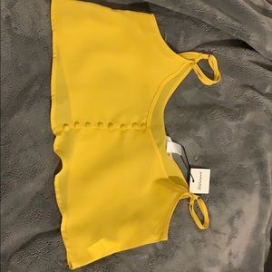 A yellow cropped top good for the summer